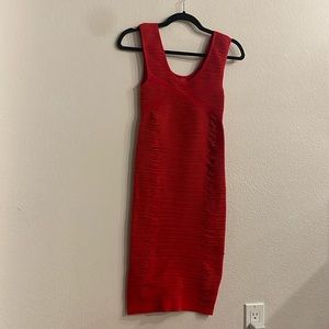 Red bodycon shape enhancing dress.